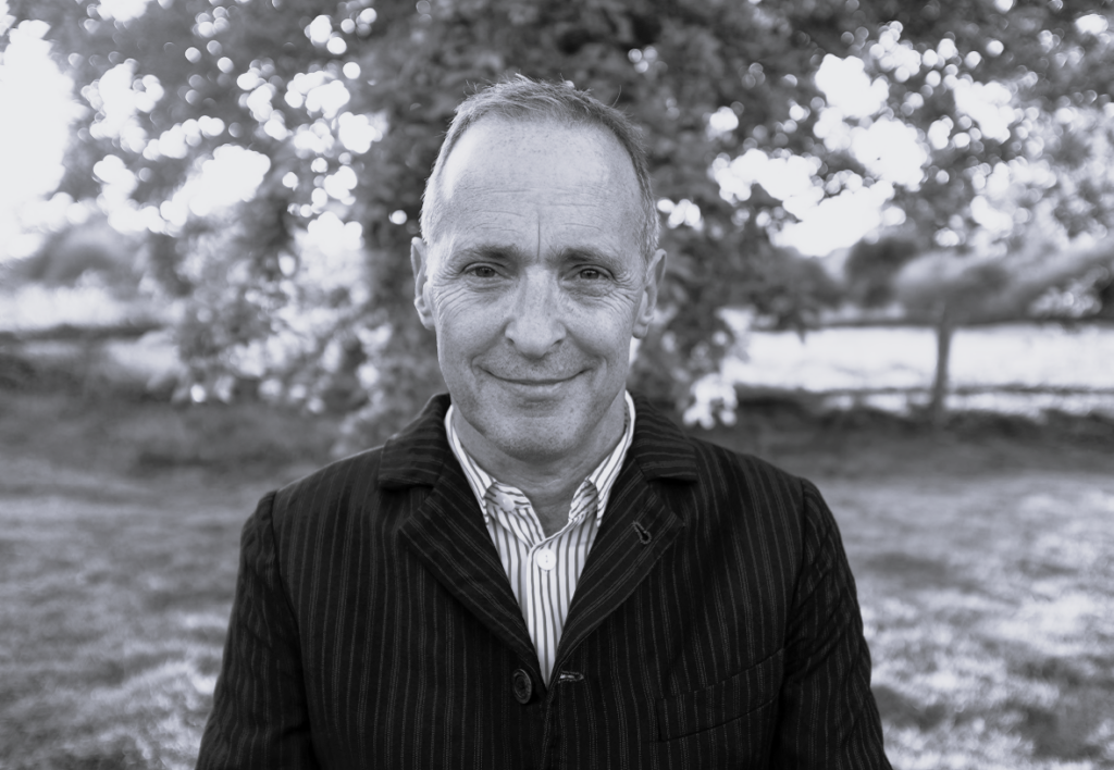 Black & white portrait of David Sedaris, by Ingrid Christie